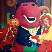 Barney with the clowns on set.