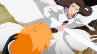 Ichigo blocks Aizen's attack.