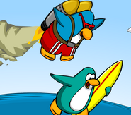 The Jet Pack Surfer helping a penguin who is surfing