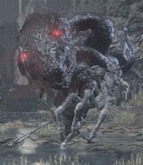 A Pus of Man emerges from the body of an infected Gundyr.