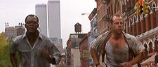 John McClane and Zeus Carver running in the streets of Manhattan.