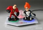 Mr. Incredible and Syndrome figures, and Monsters University/Pirates of the Caribbean/The Incredibles Playset Piece on the Infinity Base