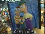 Phineas and Ferb pose for a photo with a fan at the Disney Store