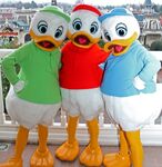 Huey, Dewey, and Louie posing for a photo at one of the Disney parks