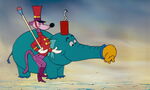 A matchstick Woozle preparing to light the match on the cannon Heffalump.