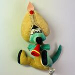 A vintage stuffed animal of the snakecharmer Woozle.