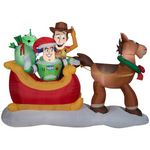 An inflatable of Woody with Buzz and a Little Green Man in a sleigh being pulled by Bullseye by Gemmy Industries