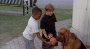 Noah and Henry giving the Buddies' balls to Deputy Sniffer