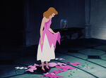 Cinderella glumly looks down at the ruins of the dress.