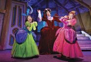 Lady Tremaine with Drizella and Anastasia.