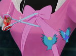 Jaq and two birds trim the bow on the bodice.