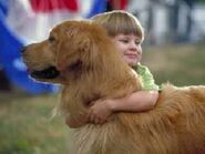 Five-year-old Noah giving Buddy a hug