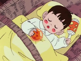 The fighter's baby holding the Dragon Ball