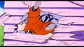 Krillin knocked backwards by Raditz