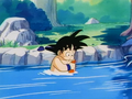 Goku bathing and doing his laundry in the river