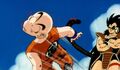 Krillin gets smacked in the face by Raditz's tail