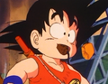 Goku trying to save Mouse by carrying him in his mouth