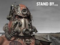 A tribal in a broken T-51b power helmet in a loading of Fallout 2