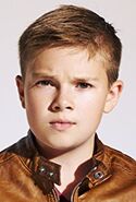 Jet Jurgensmeyer as Ness (costume that looks just like Ness's outfit)