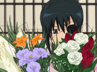 Kyuubei receiving a bouquet of flowers in Episode 154