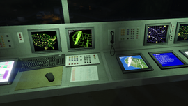 Some monitors inside the Fort Zancudo's control tower showing maps of the United States.