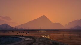 Mount Josiah viewed from the Alamo Sea with the sun setting behind it.