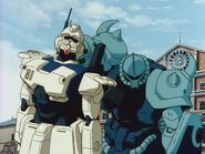 Using the disabled Gundam Ez8 as a shield (Episode 11)