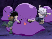 Gon and Killua beating up a slime creature