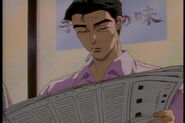 Bunta reading a newspaper