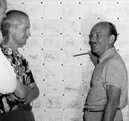 Friz Feeling with Virgil Ross (left) going over the storyboard during the production c. 1952