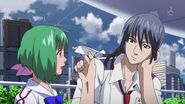 Alto asking Ranka "Why are you holding back now?" while pointing a paper airplane at her.