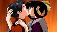 A possessed Akiko snogging a staffer.