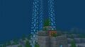 Bubble columns seen in an underwater ruin in Bedrock Edition with fancy bubbles disabled.