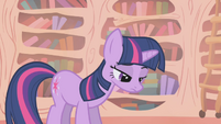 A dejected Twilight stares to the floor in shame.