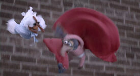 Gonzo and Camilla leap from a building in The Muppets