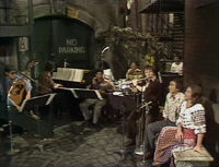 Sesame Street Episode 1051The show's house band, including Bob Cranshaw, Jim Mitchell, Danny Epstein, Steve Little, and Wally Kane, appear to play "Hummingbird."