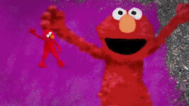 Various Muppets, including Elmo, dance in the 2009 closing credits sequence