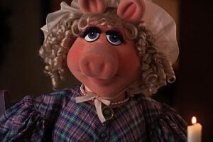 Emily CratchitWife & Mother Played by Miss Piggy