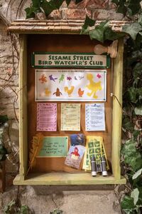 A close-up look at the Bird Watcher's Club info box found near Big Bird's nest after season 46