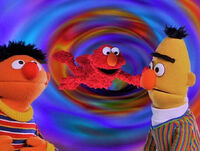 Elmo in Grouchland: Bert and Ernie watch as Elmo falls to Grouchland