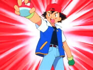 Ash holding his Voltorb alarm clock