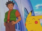 Brock and Pikachu support Ash