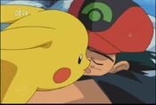 Pikachu licks Ash