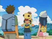 Ash places Hippopotas on his head (again)