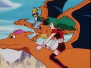 Liza riding Charla alongside Ash and Charizard