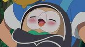 Rowlet sleeping in Ash's backpack