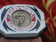 Geki's Tyrannosaurus Dino Medal inserted into his Dino Buckler.