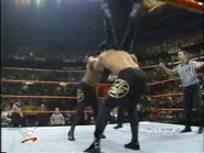 Faarooq and Bradshaw spike powerbomb Paul Ellering