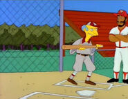 Mr. Burns, as coach, prepares to hit the ball