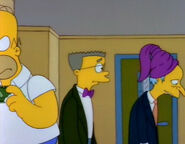 Mr. Burns wearing a purple hat in order to conceal his bad haircut